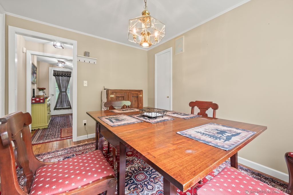 255 Dibble Hill Road Cornwall, CT 06796 - Photo 15 of 40 a dining room with a table and chairs