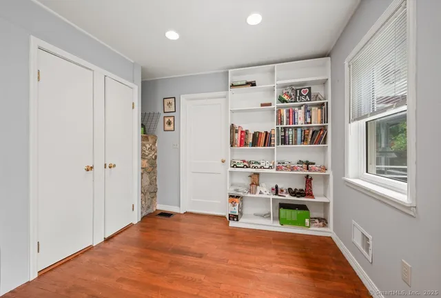 a room with furniture and a book shelf