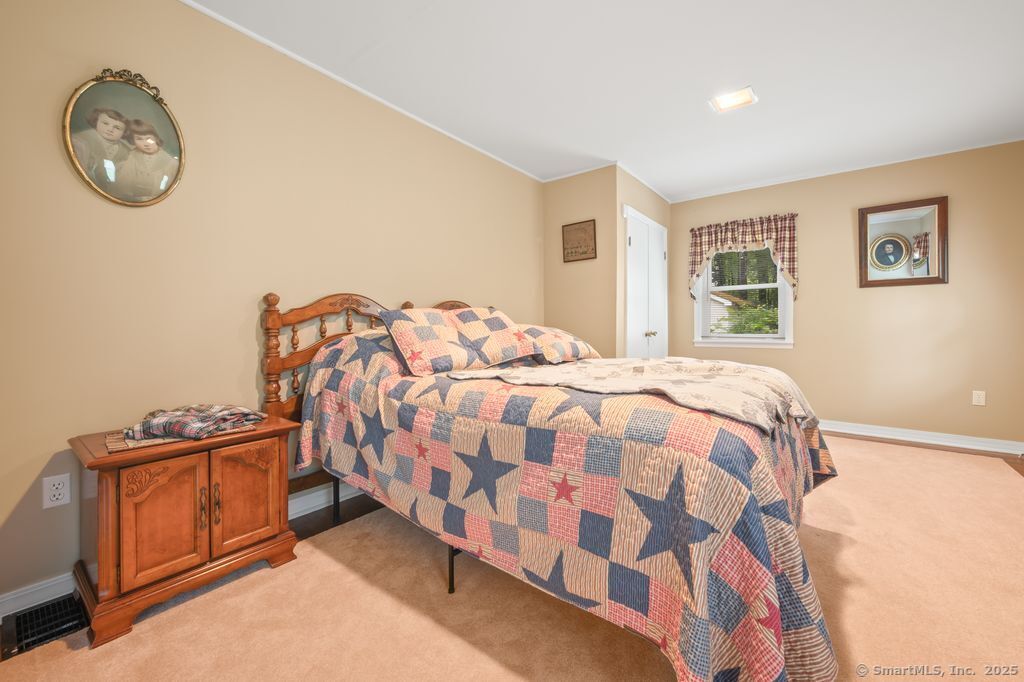 255 Dibble Hill Road Cornwall, CT 06796 - Photo 22 of 40 a bedroom with a bed and a closet