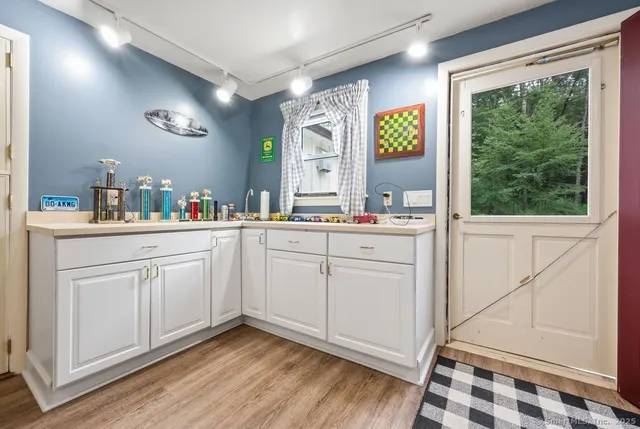 a kitchen with cabinets and window