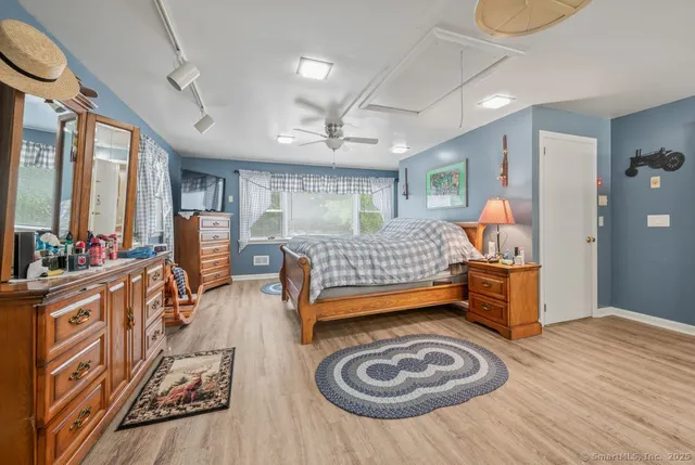 a room with furniture and a wooden floor