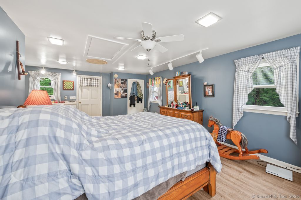 255 Dibble Hill Road Cornwall, CT 06796 - Photo 32 of 40 a bed room with a bed mirror and a window