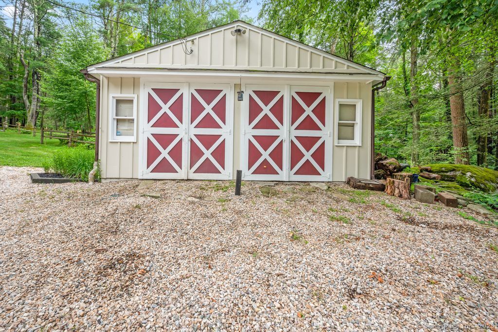 255 Dibble Hill Road Cornwall, CT 06796 - Photo 40 of 40 a wooden house with red and white fence