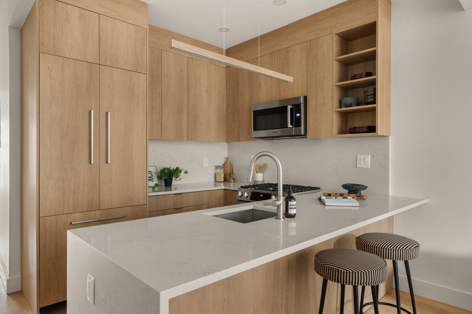 1230 Putnam Avenue, Unit 2 Brooklyn, NY 11221 - Photo 5 of 13 a kitchen with a sink a microwave and cabinets