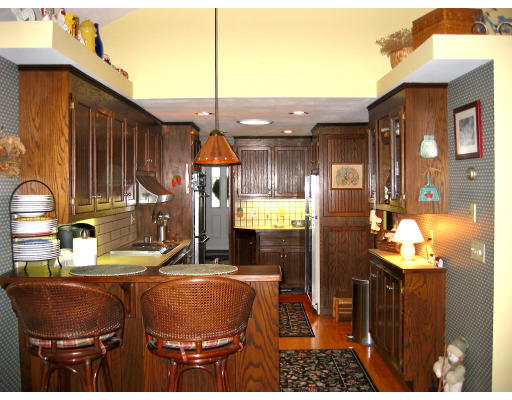 6 Enslin Road Needham, MA 02492 - Photo 6 of 7 a backyard of a house with barbeque oven table and chairs