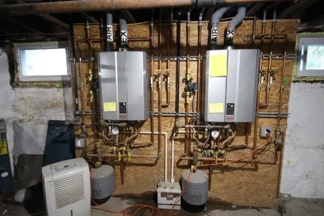 a bathroom with a toilet and a mirror
