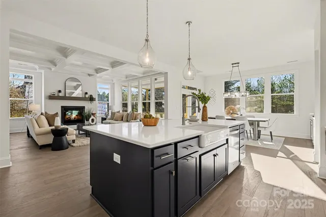 a view of an entryway with wooden floor and windows