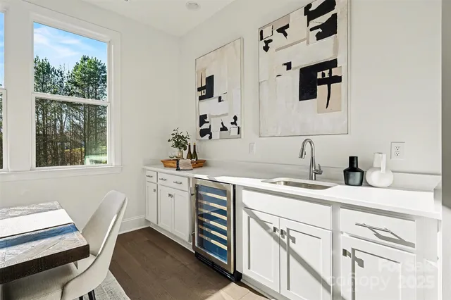 a view of a dining room and hall with furniture