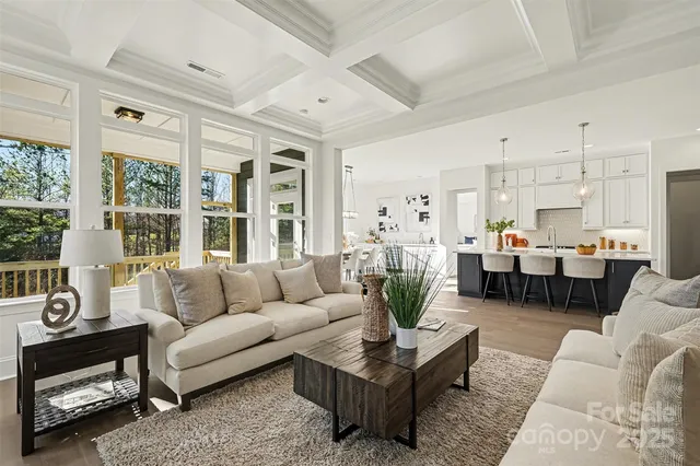 a bathroom with a granite countertop sink a mirror a shower and vanity