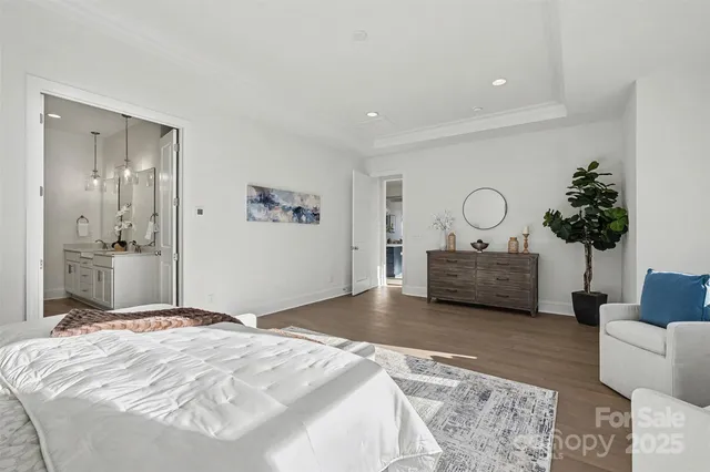 a dining room with a table chairs and a kitchen view