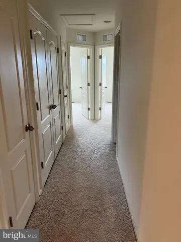 a view of hallway with shower