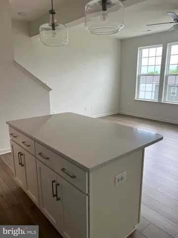 a view of cabinets and wooden floor