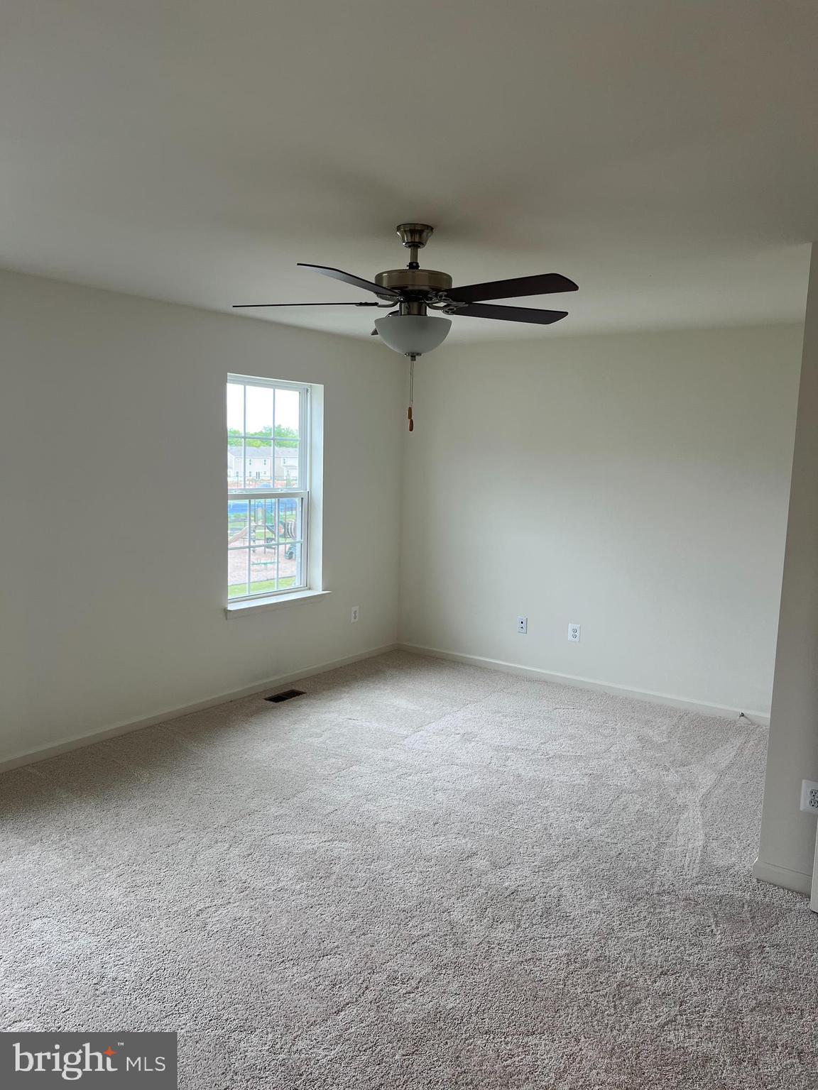 115 Clifton Manor Falling Waters, WV 25419 - Photo 6 of 29 an empty room with windows and fan