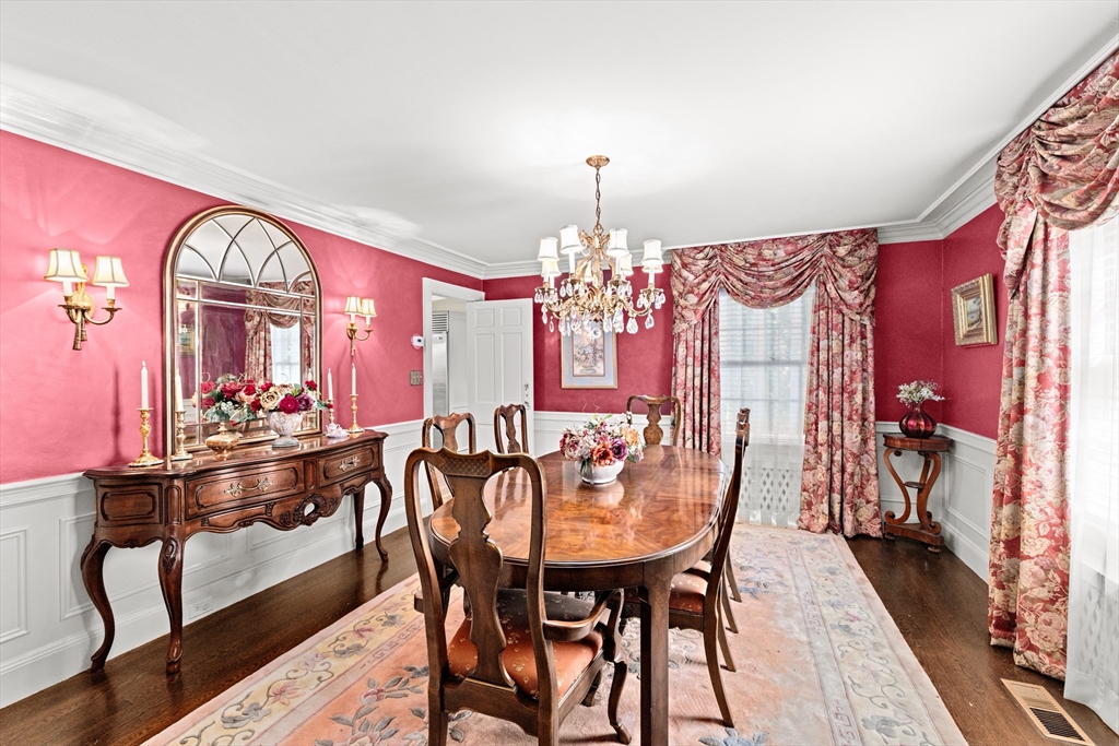 443 Chestnut Street Newton, MA 02468 - Photo 12 of 28 a view of a dining room with furniture and chandelier