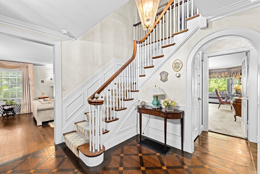 443 Chestnut Street Newton, MA 02468 - Photo 13 of 28 a view of entryway with wooden floor and a rug