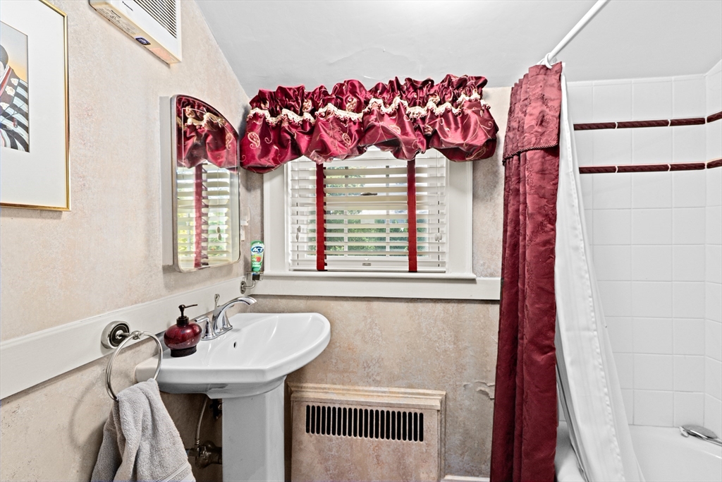 443 Chestnut Street Newton, MA 02468 - Photo 24 of 28 a bathroom with a sink and a mirror