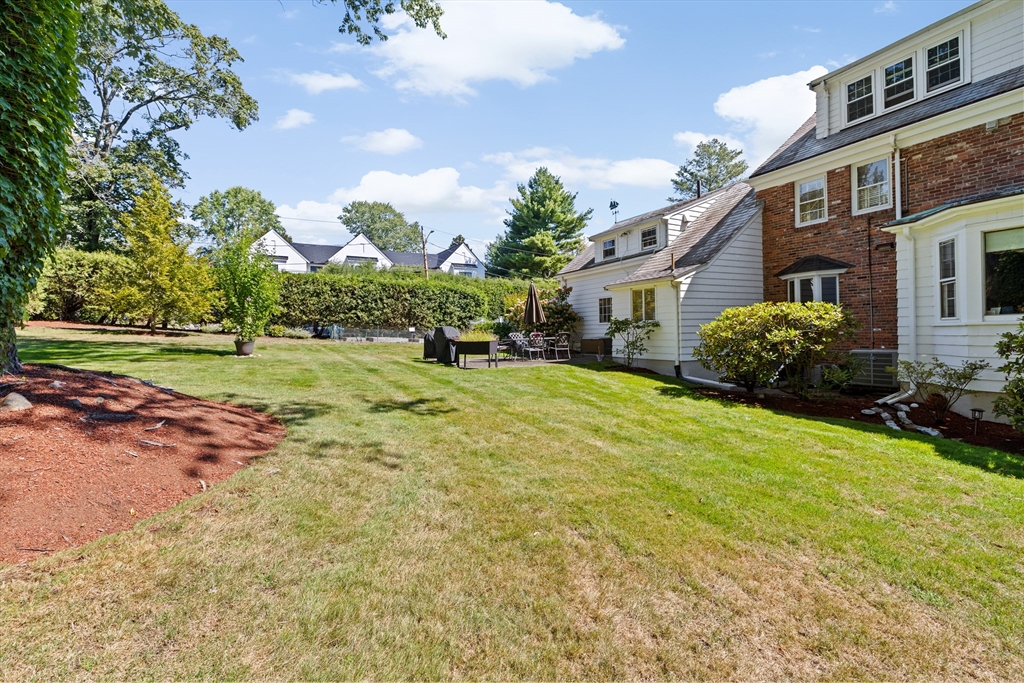 443 Chestnut Street Newton, MA 02468 - Photo 8 of 28 a view of a house with a yard and street