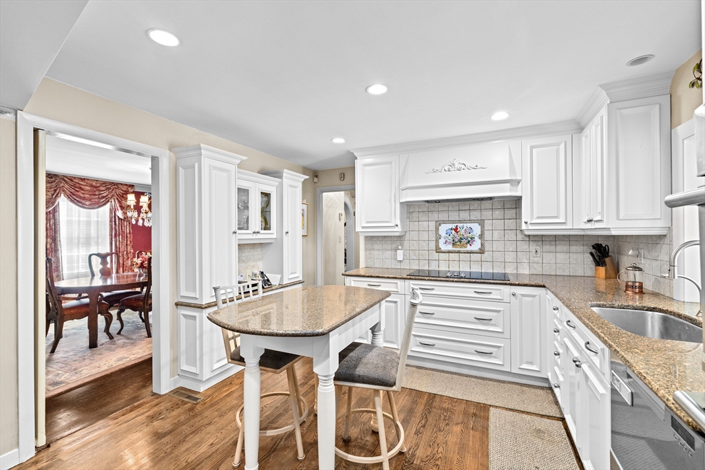 443 Chestnut Street Newton, MA 02468 - Photo 10 of 28 a kitchen with a table chairs stove and cabinets