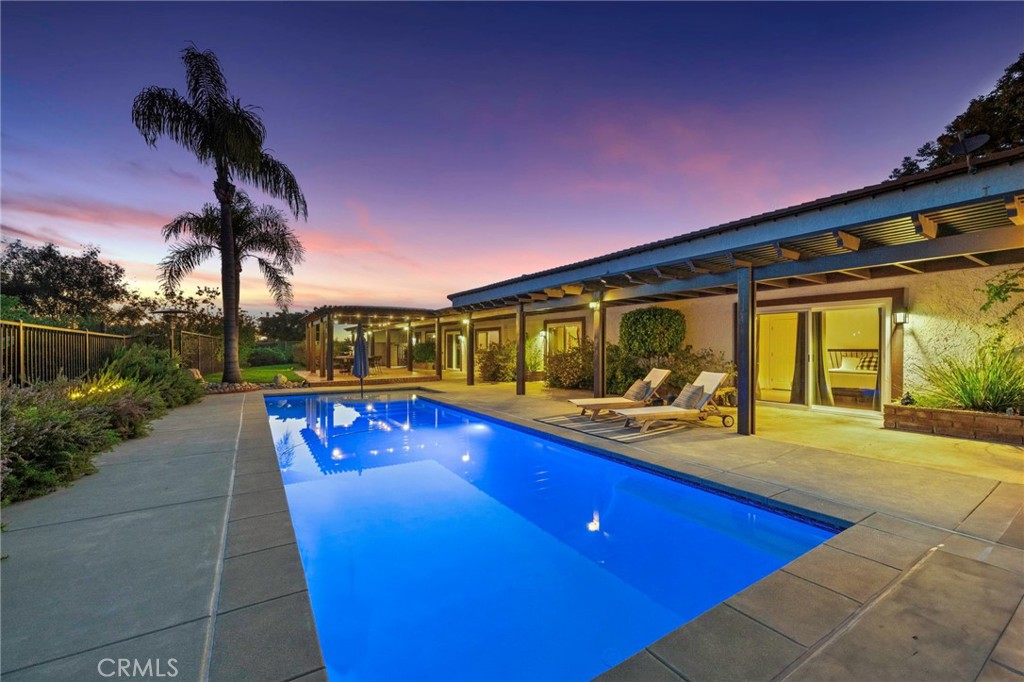 39386 Chaparral Drive Temecula, CA 92592 - Photo 1 of 1 a swimming pool with outdoor seating and yard