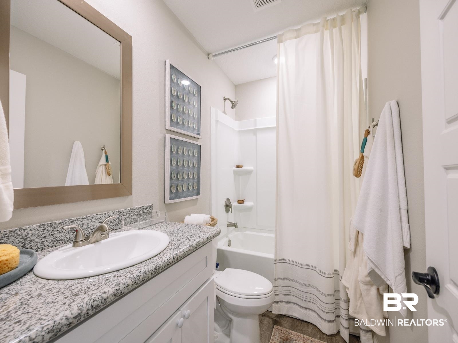23911 Peppermint Street Elberta, AL 36530 - Photo 14 of 18 Full bathroom with vanity and shower / bath combo with shower curtain