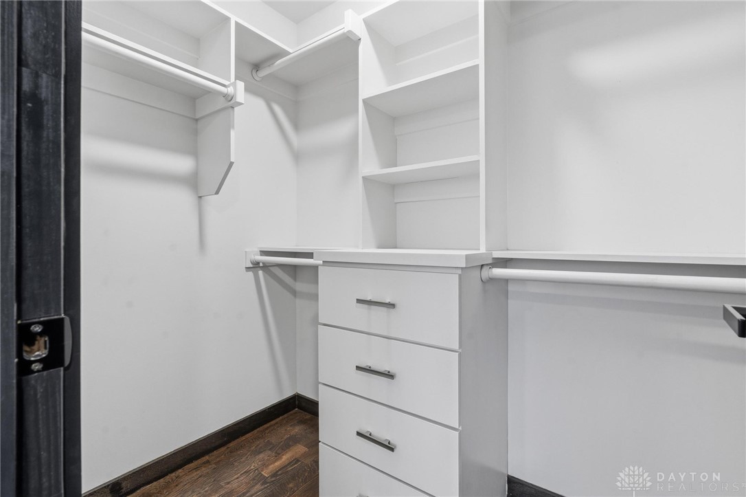 3509 South State Rte 72 Sabina, OH 45169 - Photo 32 of 44 An organized closet featuring built-in shelving and drawers, offering ample storage space.