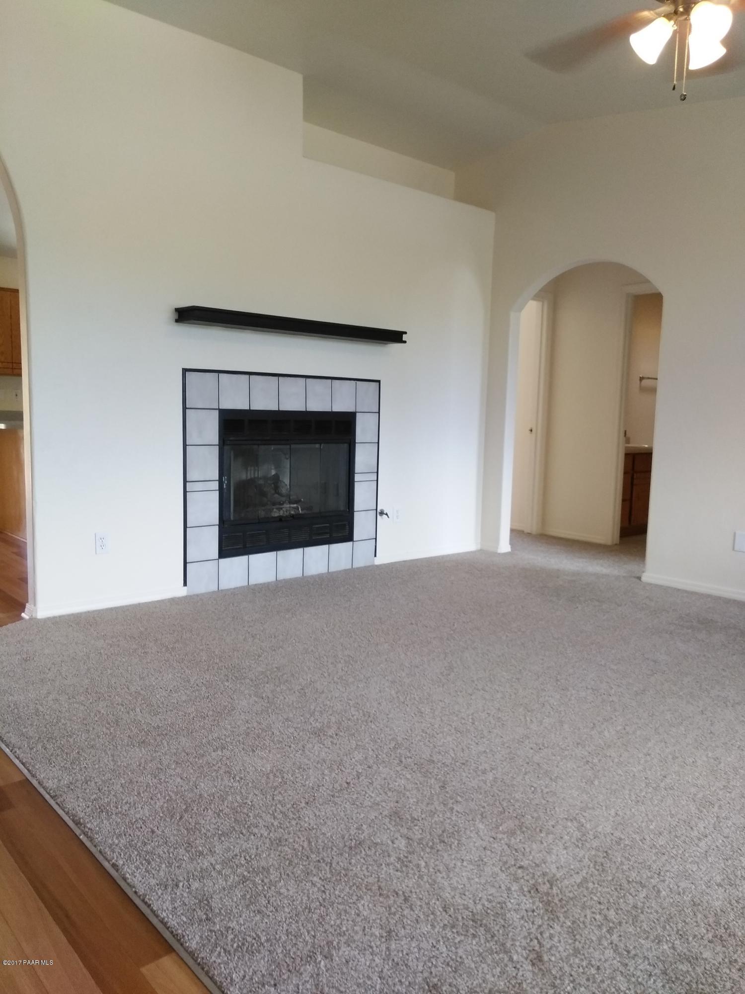 5148 North Long Rifle Road Prescott Valley, AZ 86314 - Photo 15 of 30 Living Room - Gas Fireplace - Arched Ent