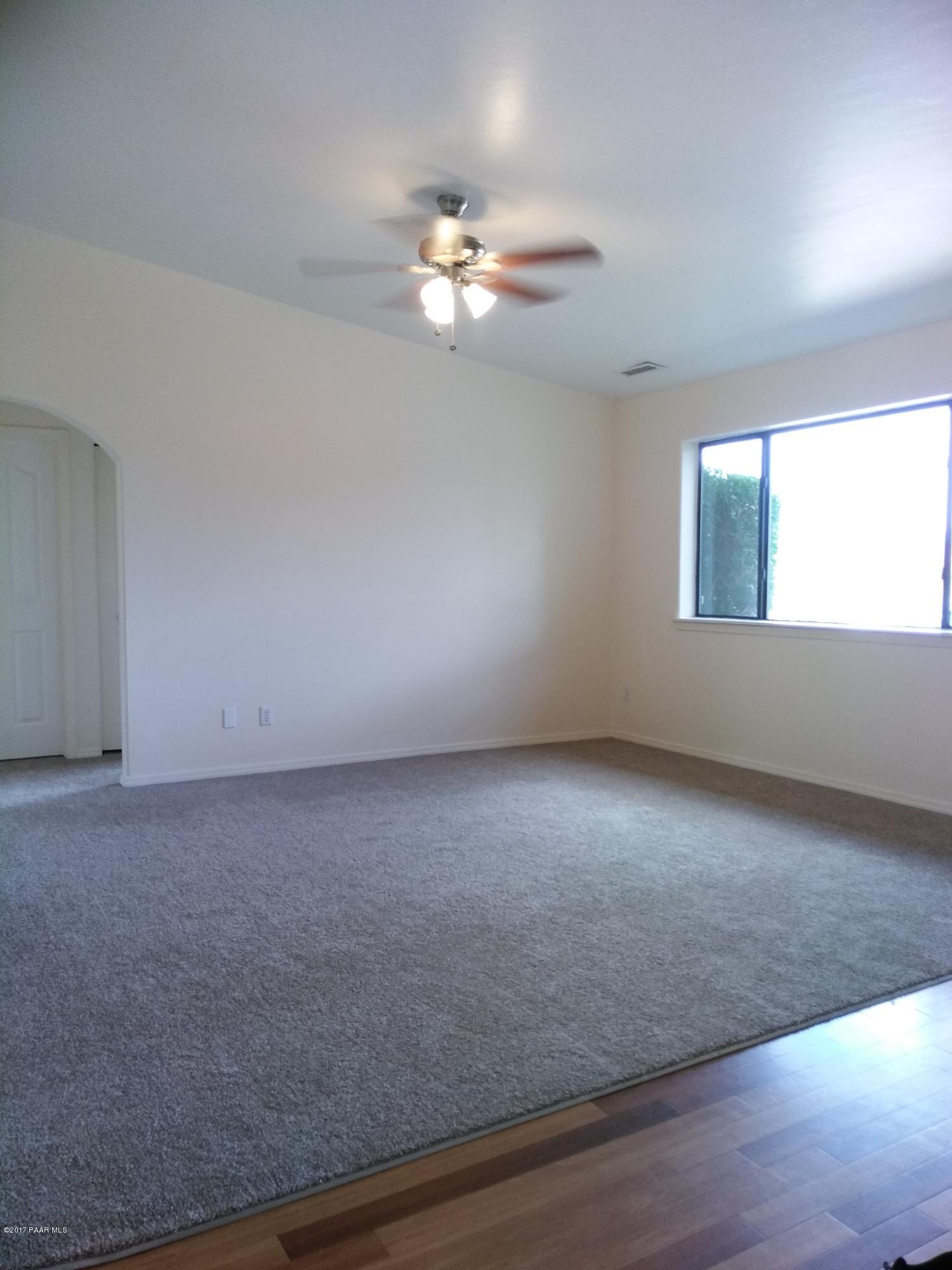 5148 North Long Rifle Road Prescott Valley, AZ 86314 - Photo 4 of 30 Living Room with Arched Entrance to Bedr