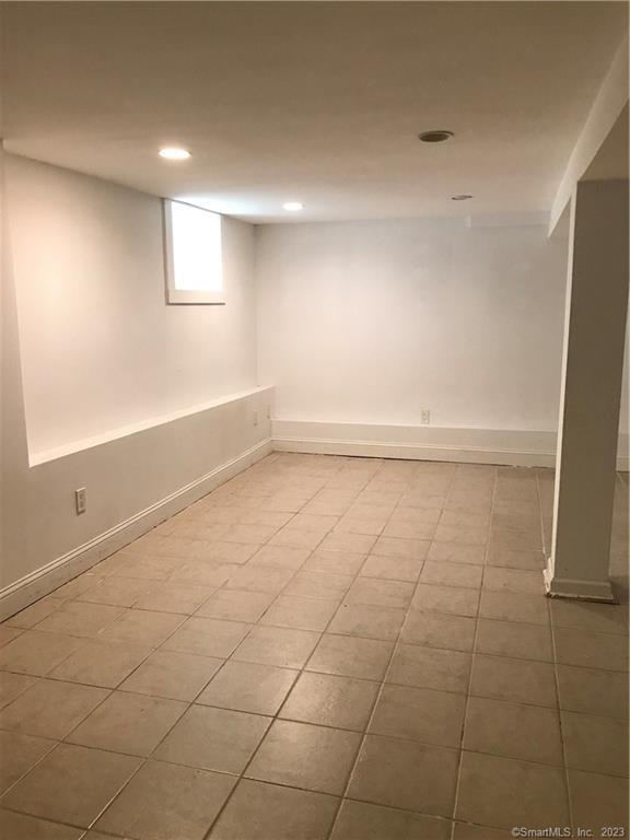 42 Weed Hill Avenue Stamford, CT 06907 - Photo 12 of 26 a view of an empty room with a window