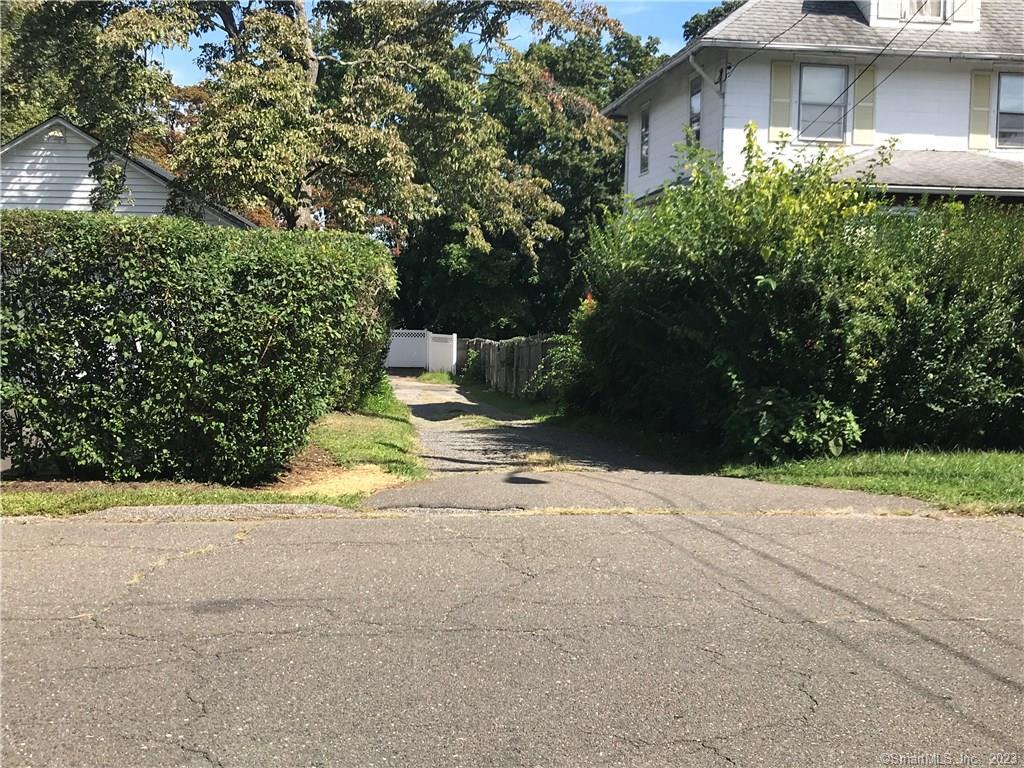 42 Weed Hill Avenue Stamford, CT 06907 - Photo 26 of 26 a view of a house with a yard and potted plants