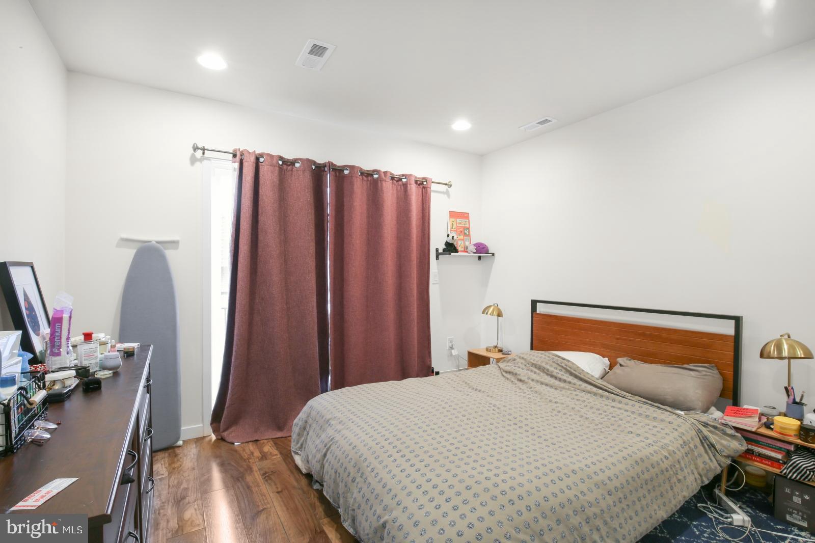 134 South 46th Street, Unit C Philadelphia, PA 19139 - Photo 13 of 17 a bedroom with a bed a desk and chair