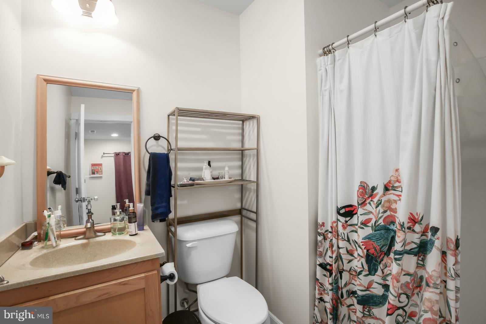 134 South 46th Street, Unit C Philadelphia, PA 19139 - Photo 15 of 17 a bathroom with a sink toilet and shower