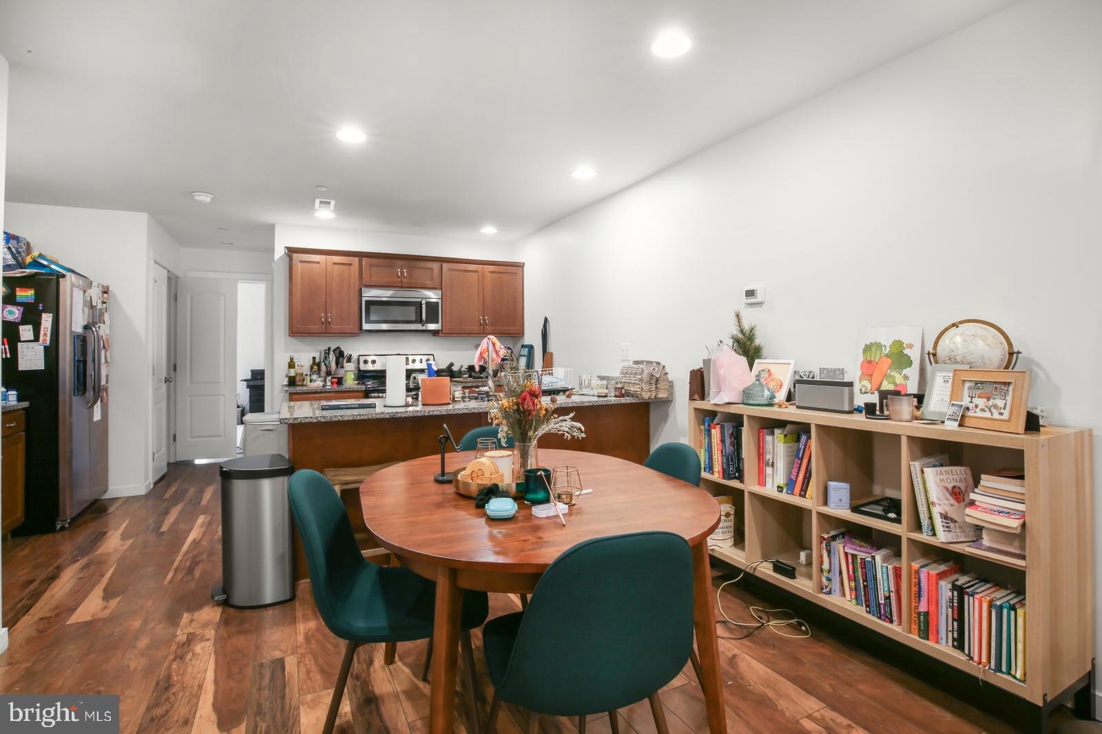 134 South 46th Street, Unit C Philadelphia, PA 19139 - Photo 4 of 17 a dining room with furniture and a wooden floor