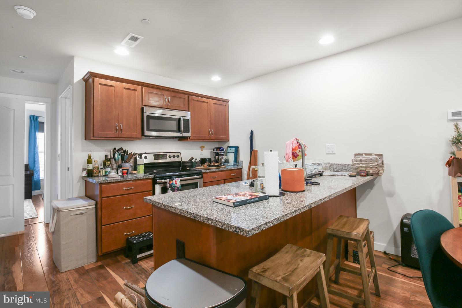 134 South 46th Street, Unit C Philadelphia, PA 19139 - Photo 5 of 17 a kitchen with a sink stove and microwave