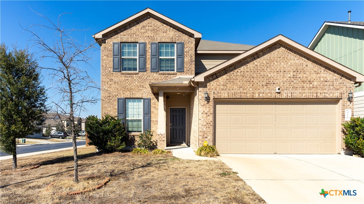 620 English Oak Street Georgetown, TX 78626 - Photo 1 of 29 a front view of a house with garden