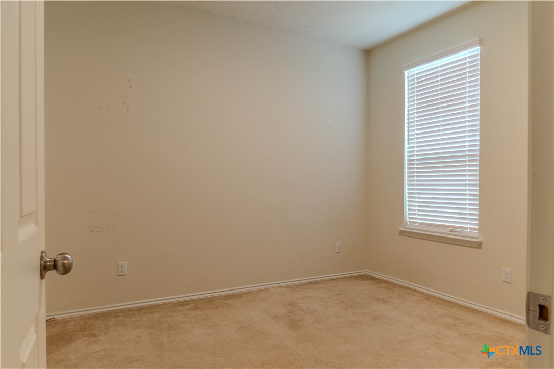 620 English Oak Street Georgetown, TX 78626 - Photo 12 of 29 a view of an empty room with a window