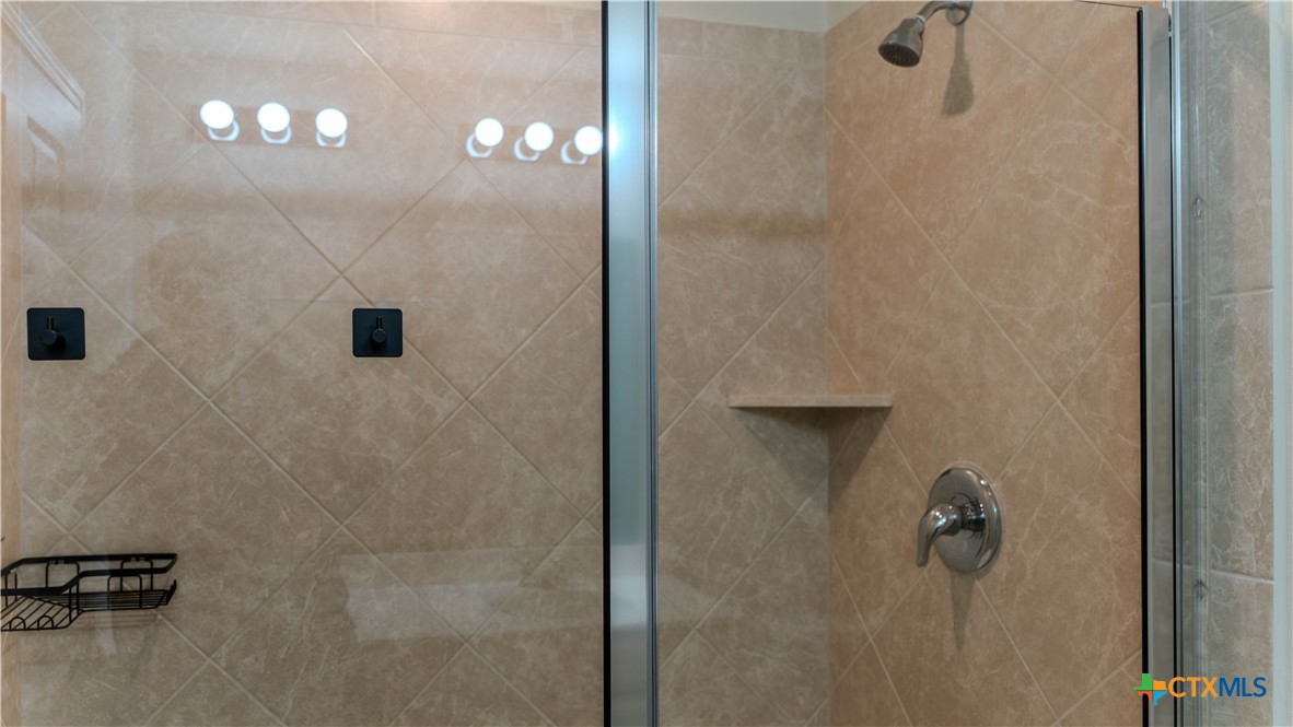 620 English Oak Street Georgetown, TX 78626 - Photo 14 of 29 a bathroom with a shower