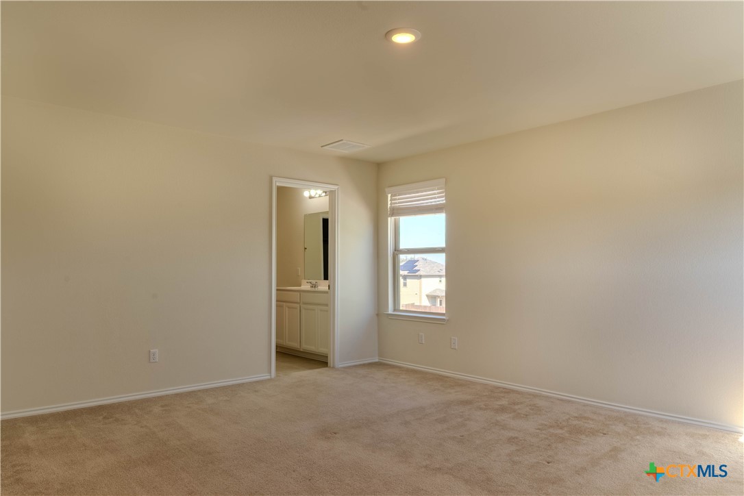 620 English Oak Street Georgetown, TX 78626 - Photo 16 of 29 an empty room with windows