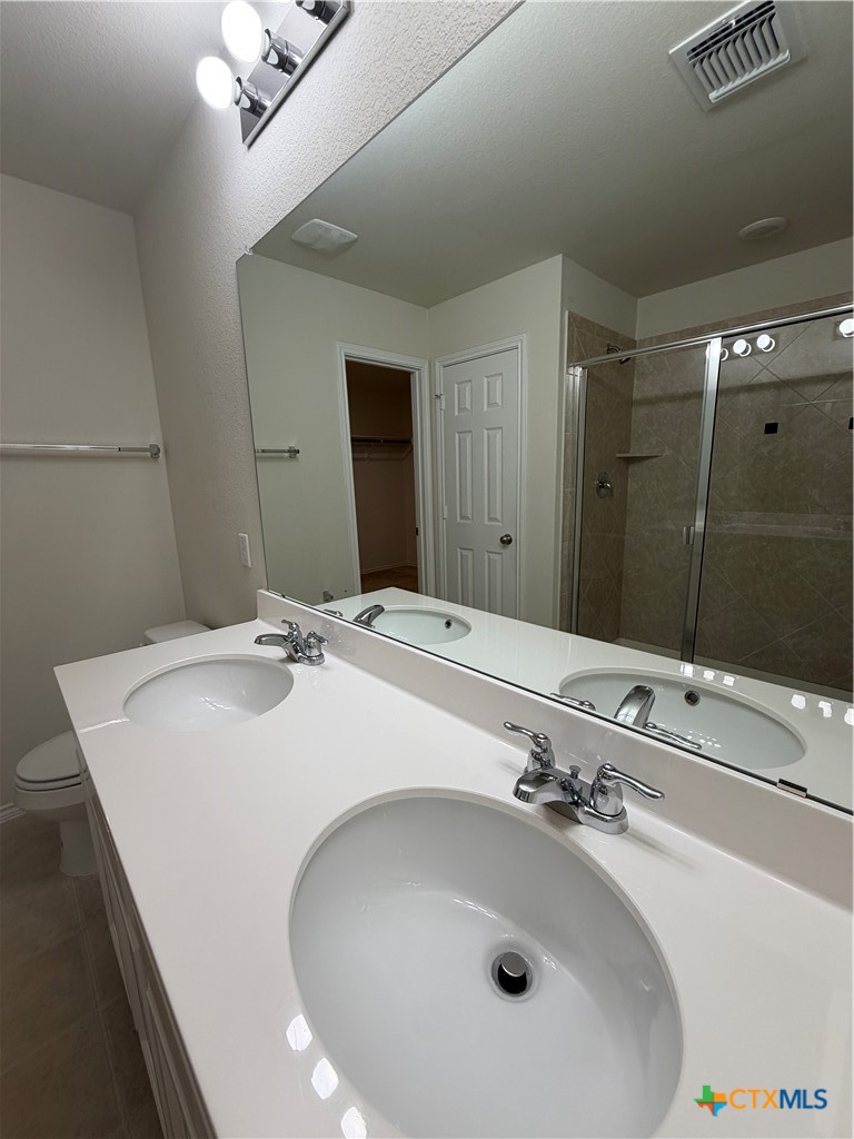 620 English Oak Street Georgetown, TX 78626 - Photo 18 of 29 a bathroom with a sink and a mirror