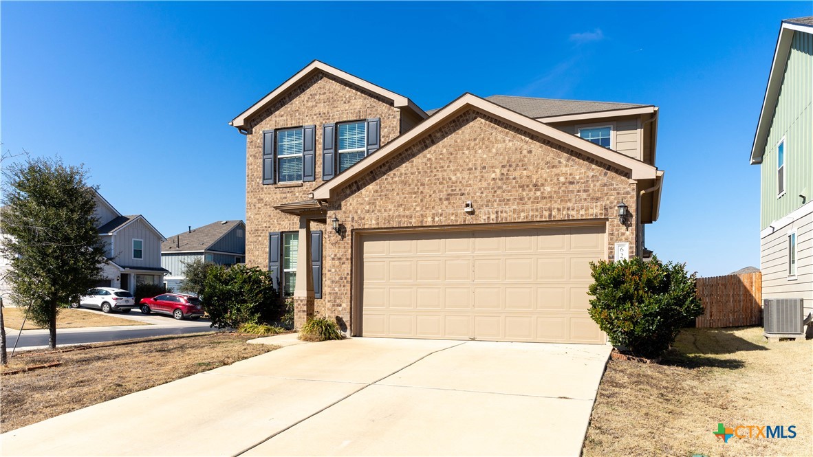 620 English Oak Street Georgetown, TX 78626 - Photo 2 of 29 a view of a house with a yard and garage