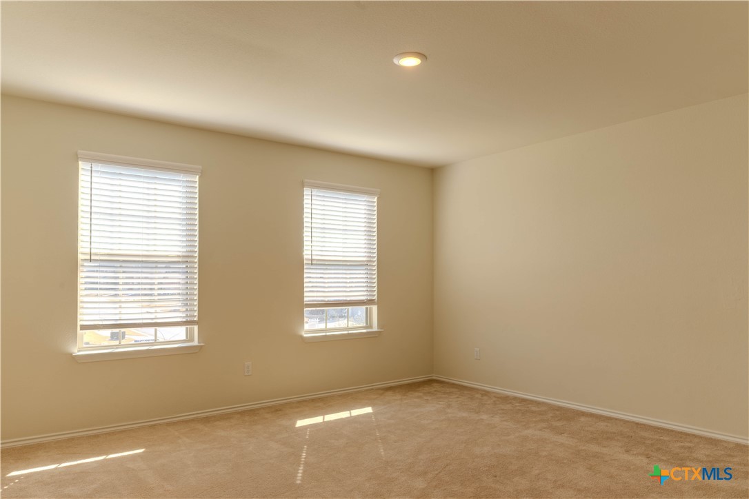 620 English Oak Street Georgetown, TX 78626 - Photo 21 of 29 an empty room with windows