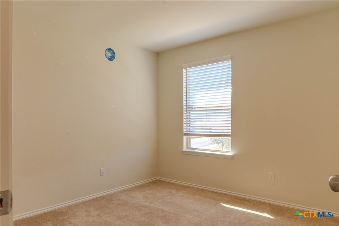 620 English Oak Street Georgetown, TX 78626 - Photo 22 of 29 an empty room with windows