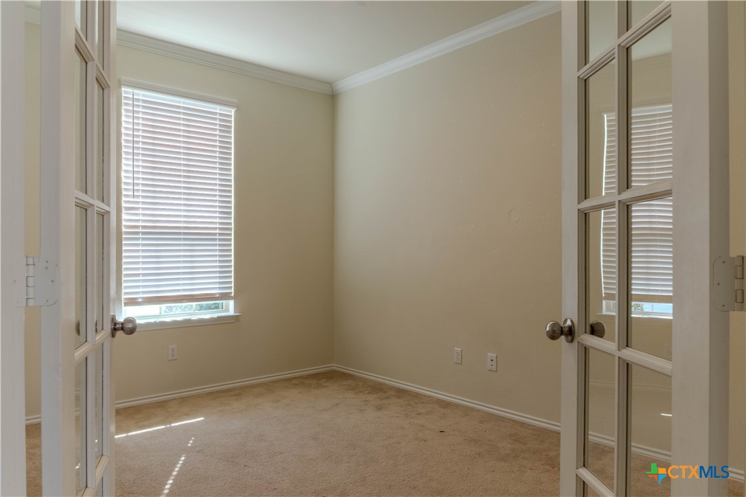 620 English Oak Street Georgetown, TX 78626 - Photo 5 of 29 a view of an empty room with a window