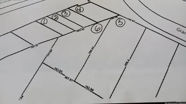 a view of a door with white walls