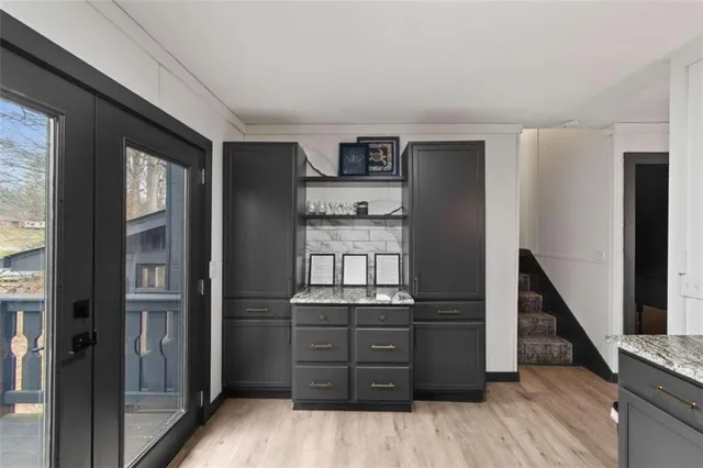 a view of a hallway with windows and stairs