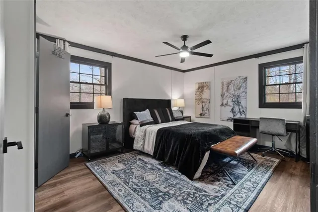 a bedroom with a large bed and a window