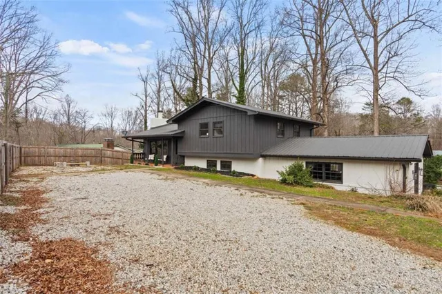 a view of a house with snow on the background