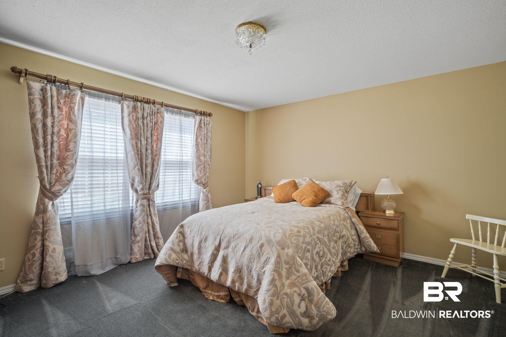950 Walter Smith Road Mobile, AL 36695 - Photo 17 of 51 Carpeted bedroom featuring baseboards