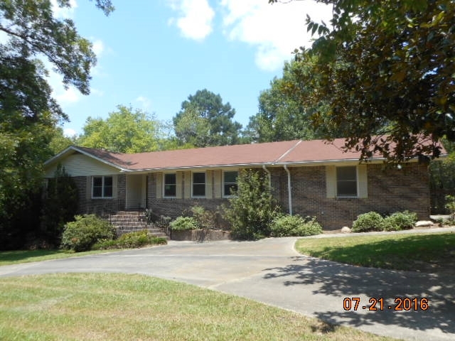 4315 Jones Road Macon, GA 31216 - Photo 1 of 26 a front view of a house with garden