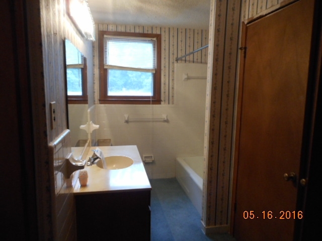 4315 Jones Road Macon, GA 31216 - Photo 23 of 26 a bathroom with a sink and a mirror