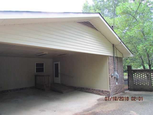 4315 Jones Road Macon, GA 31216 - Photo 4 of 26 a backyard of a house with garage